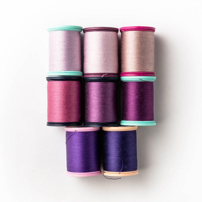 Sewing thread - crimson + purple shades