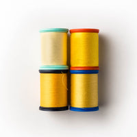Yellow and sunflower shades of sewing thread
